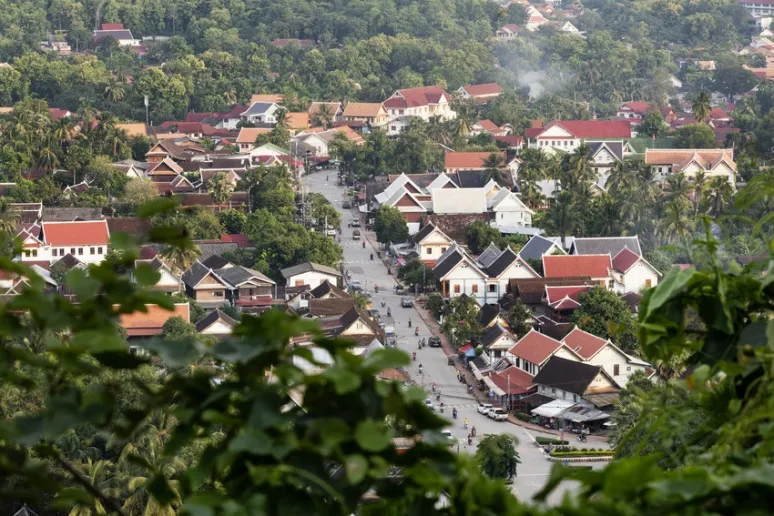 Looking down at the main street of a town, with buildings either side.