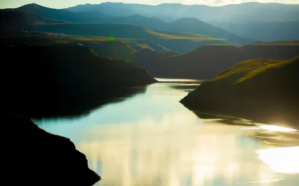 Scenic river winding through a mountainous valley.