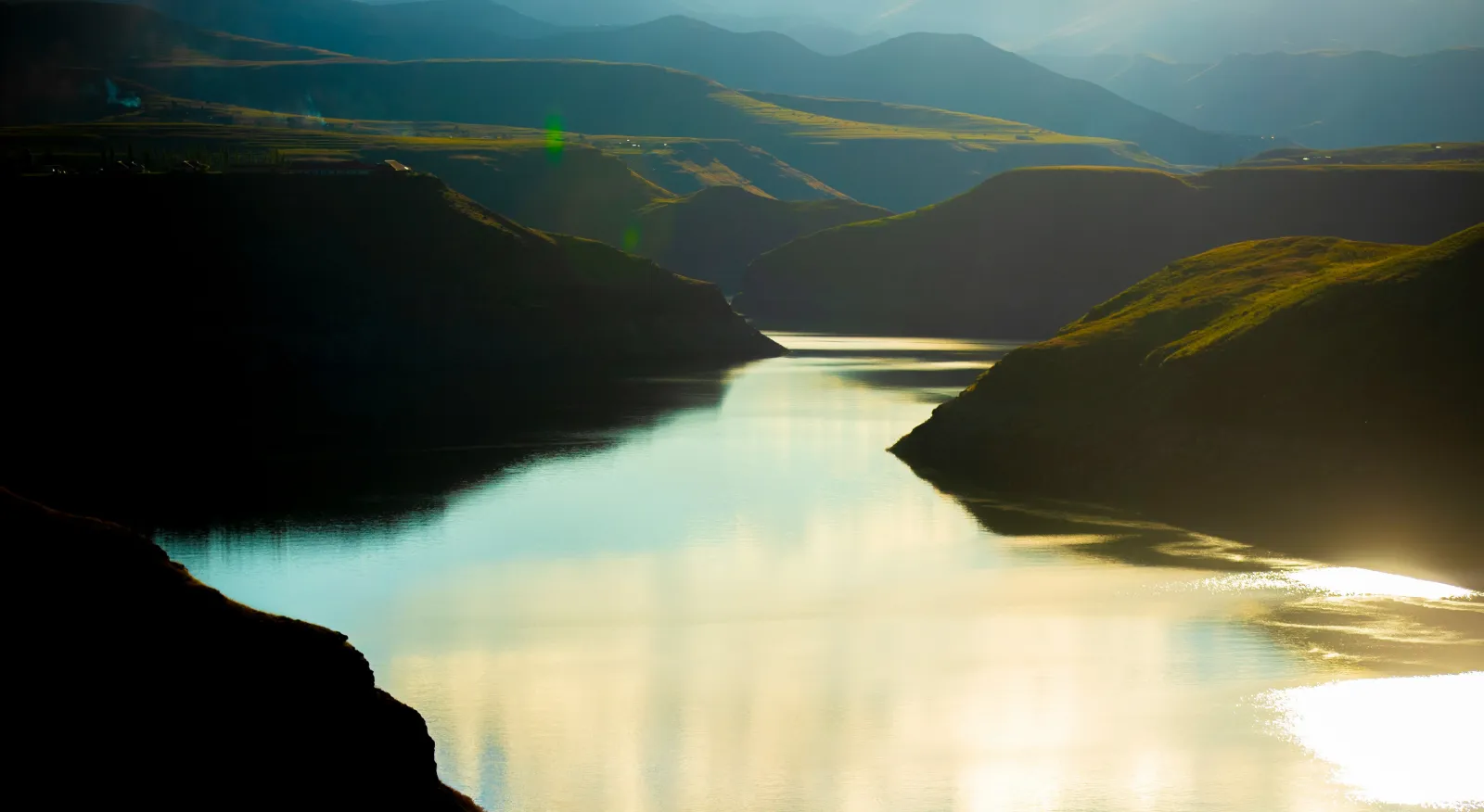 Scenic river winding through a mountainous valley.