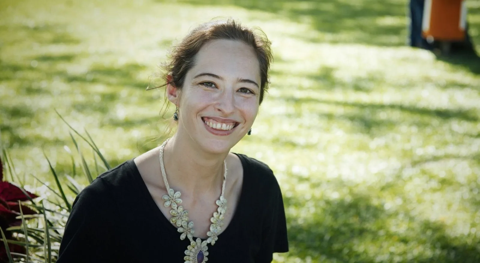 A person standing in a field of grass.